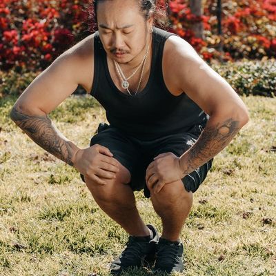 Close-up on a person's focused expression during a workout.